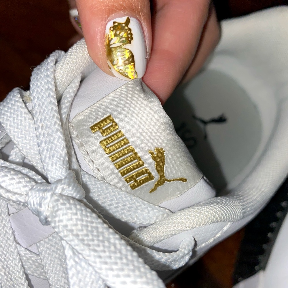 Puma white platform sneaker shoes with gold and black accents